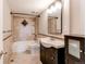 Bathroom with tiled shower, vanity, and a rectangular mirror, offering functionality and style at 4392 E 126Th Pl, Thornton, CO 80241