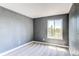 Bedroom featuring neutral colors and a large window with outside views at 4392 E 126Th Pl, Thornton, CO 80241