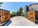 Large driveway and outbuilding surrounded by mature trees at 4392 E 126Th Pl, Thornton, CO 80241