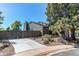Home exterior with driveway and mature trees, combining comfort and curb appeal at 4392 E 126Th Pl, Thornton, CO 80241