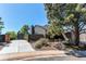 Charming home exterior with a paved driveway, shed and stone landscaping, perfect for suburban living at 4392 E 126Th Pl, Thornton, CO 80241
