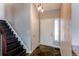 Welcoming foyer with a staircase and tile floors, leading to the main living areas at 4392 E 126Th Pl, Thornton, CO 80241