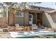 Charming front porch with chairs and a table, perfect for enjoying the outdoors at 4392 E 126Th Pl, Thornton, CO 80241