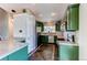 Modern kitchen with updated appliances, ample cabinet space, and stylish tile flooring at 4392 E 126Th Pl, Thornton, CO 80241