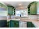 Well-equipped kitchen with stainless steel appliances and a window providing natural light at 4392 E 126Th Pl, Thornton, CO 80241