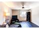 Cozy living room with dark hardwood floors, a ceiling fan, and a comfortable gray chaise lounge at 4392 E 126Th Pl, Thornton, CO 80241