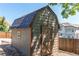 Exterior view of a barn style shed with blue roof and khaki siding in backyard, ideal for storage at 4392 E 126Th Pl, Thornton, CO 80241