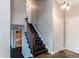 Staircase with wood treads, white risers, and a wooden banister leads to the upper level at 4392 E 126Th Pl, Thornton, CO 80241