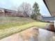 Expansive backyard featuring a patio, lush lawn, mature trees, and storage shed; an ideal outdoor space at 10253 W 68Th Way, Arvada, CO 80004
