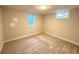 Empty bedroom with carpet, two windows, and neutral paint, ready to be transformed at 10253 W 68Th Way, Arvada, CO 80004
