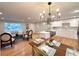 Open concept living space with updated kitchen, dining area, and living room at 10253 W 68Th Way, Arvada, CO 80004