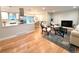 Bright and open concept living space with updated kitchen, dining area, and living room with fireplace at 10253 W 68Th Way, Arvada, CO 80004