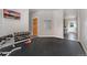 Functional home gym space with free weights, rubber flooring, and wall-mounted TV for entertainment at 938 Spruce Rd, Larkspur, CO 80118