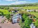 This property features a home with an attached two-car garage and an expansive lawn surrounded by mature trees at 767 Ellis St, Golden, CO 80401