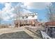 Backyard featuring brick patio and wooden deck at 767 Ellis St, Golden, CO 80401