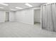 Basement space featuring neutral carpet and two closet doors at 767 Ellis St, Golden, CO 80401