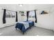 Bright bedroom with carpet flooring, windows, and cute decor on shelves at 767 Ellis St, Golden, CO 80401