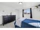 Bedroom featuring a closet, chest of drawers, and a window with black curtains at 767 Ellis St, Golden, CO 80401
