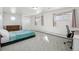 Bright bedroom with neutral carpet, closet, and two windows at 767 Ellis St, Golden, CO 80401