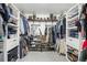 Walk-in closet with custom shelving and storage for organizing clothes and shoes at 767 Ellis St, Golden, CO 80401