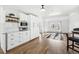 Bright living area features hardwood floors, white cabinets, and a large window for natural light at 767 Ellis St, Golden, CO 80401