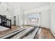 Inviting living room with vaulted ceilings, large windows, hardwood floors, and a decorative rug at 767 Ellis St, Golden, CO 80401