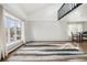 Spacious living area with a large window, hardwood floors, and access to the upper level at 767 Ellis St, Golden, CO 80401