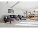Spacious living room with hardwood floors, comfortable seating, and an open layout to the dining area at 767 Ellis St, Golden, CO 80401