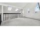 Bright loft area features skylights, carpeted floors, and a view of the home's interior at 767 Ellis St, Golden, CO 80401