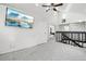 Open loft area with vaulted ceiling, skylights, and a large wall-mounted television at 767 Ellis St, Golden, CO 80401