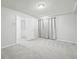 Neutral carpeted room with gray curtains and a closet at 767 Ellis St, Golden, CO 80401
