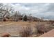 View of the community landscaping from back yard at 16159 W 70Th Pl, Arvada, CO 80007