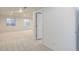 Finished basement with plush neutral carpeting, egress windows and neutral walls at 16159 W 70Th Pl, Arvada, CO 80007
