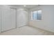 View of basement bedroom featuring neutral carpet and double bi-fold closets at 16159 W 70Th Pl, Arvada, CO 80007