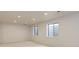 Basement has recessed lighting, plush carpet and large egress windows at 16159 W 70Th Pl, Arvada, CO 80007