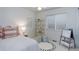 Bright bedroom with playful decor, comfy bedding, and neutral carpet at 16159 W 70Th Pl, Arvada, CO 80007