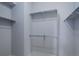 Walk in closet featuring multiple rods for maximum storage and organization at 16159 W 70Th Pl, Arvada, CO 80007