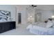 Bright bedroom featuring plush carpets and an alcove perfect for a sitting area or home office at 16159 W 70Th Pl, Arvada, CO 80007