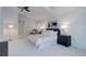 Spacious and airy bedroom with high ceilings, plush carpeting, and ample natural light at 16159 W 70Th Pl, Arvada, CO 80007