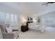 Well-lit and spacious bedroom with a comfortable sitting area and abundant natural light at 16159 W 70Th Pl, Arvada, CO 80007