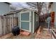 Storage shed located on side of home with a wood fence at 16159 W 70Th Pl, Arvada, CO 80007