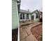 Landscaped backyard featuring a patio, stone pathway, and lush lawn at 9806 Hooker Ct, Westminster, CO 80031