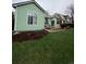 Landscaped backyard featuring a patio, stone pathway, and lush lawn at 9806 Hooker Ct, Westminster, CO 80031
