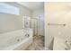 Bathroom featuring a tub, glass shower and vanity with great lighting at 9806 Hooker Ct, Westminster, CO 80031