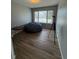Bedroom featuring a large window and hardwood floors at 9806 Hooker Ct, Westminster, CO 80031