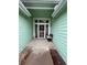 Charming front entrance with storm door, bench, and well-maintained landscaping at 9806 Hooker Ct, Westminster, CO 80031
