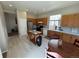 Open concept kitchen featuring wooden cabinets and tile flooring at 9806 Hooker Ct, Westminster, CO 80031