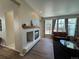 Bright living room featuring a fireplace and large windows at 9806 Hooker Ct, Westminster, CO 80031