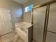 Bright main bathroom featuring a jetted tub and shower with glass doors at 9806 Hooker Ct, Westminster, CO 80031