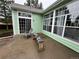 Covered patio area with outdoor seating and large windows for natural light at 9806 Hooker Ct, Westminster, CO 80031